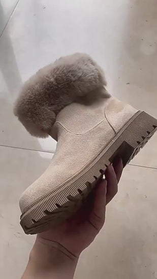 Video of beige ankle boots with fur lining in motion